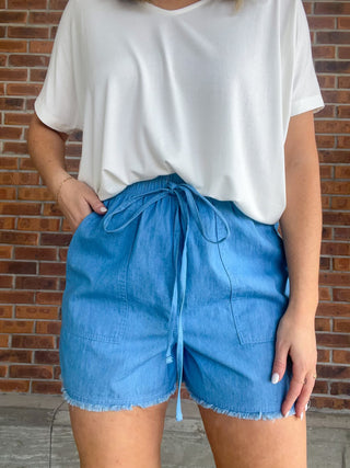 The Washed Denim Frayed Hem Shorts