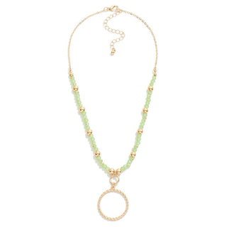 Short Beaded Necklace Featuring Twisted Metal Circle Pendant