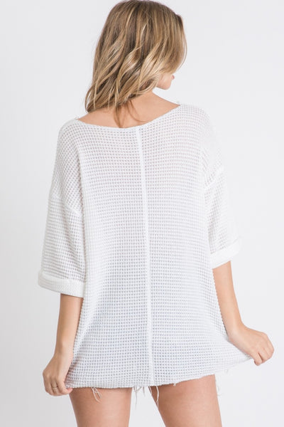 Solid waffle knit top with reverse stitch details