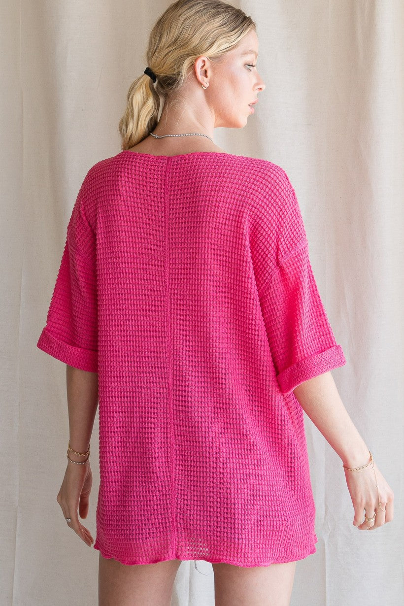 Solid waffle knit top with reverse stitch details